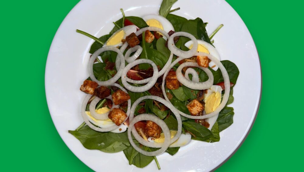 Spinach salad with Green Background